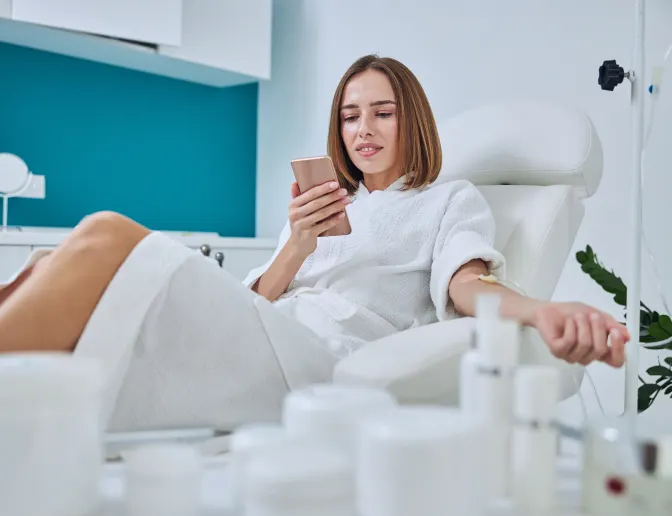 Woman relaxing while receiving an IV Therapy Drip