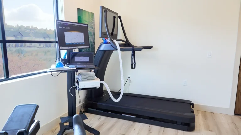 Computer, machinery, and a treadmill in a clinic setting. Can be used to assist with tests such as resting metabolic rate.