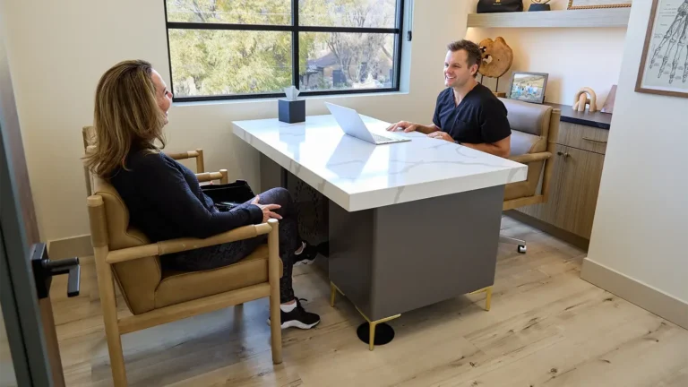 A man and a woman having a consultation in a health care clinic regarding "weight loss medications near me"